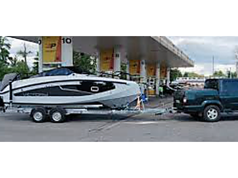 No, passengers are never permitted in a towed trailer — Alberta safe-driving road sign for Class 7 test