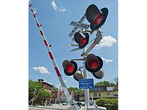 Stop at least 5 metres from the nearest rail and wait for the train to pass — Alberta railway-crossings road sign for Class 7 test
